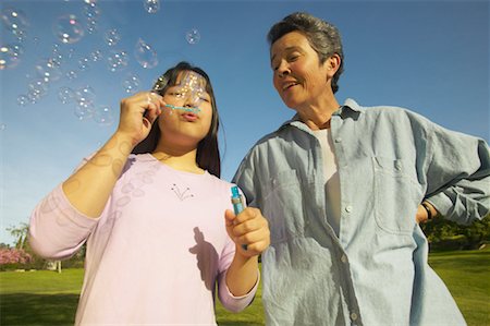 simsearch:700-00046927,k - Grandmother and Granddaughter Blowing Bubbles Stock Photo - Rights-Managed, Code: 700-00550608
