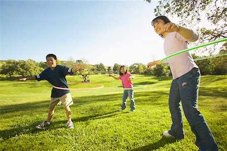 simsearch:649-06812049,k - Children Hulahooping Stock Photo - Rights-Managed, Code: 700-00550611