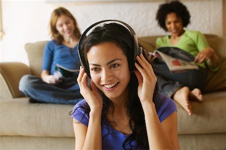 simsearch:700-00038500,k - Woman Listening to Headphones Stock Photo - Rights-Managed, Code: 700-00550838