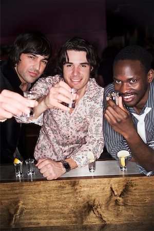 Portrait of Men at Nightclub Toasting Stock Photo - Rights-Managed, Code: 700-00551307