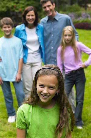 simsearch:700-00073572,k - Girl Standing in Front of Family Stock Photo - Rights-Managed, Code: 700-00551438