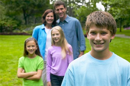 simsearch:700-00073572,k - Boy Standing in Front of Family Stock Photo - Rights-Managed, Code: 700-00551439