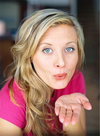simsearch:700-00795365,k - Portrait of Woman Blowing a Kiss Stock Photo - Rights-Managed, Code: 700-00552310