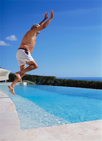 simsearch:700-00552897,k - Man Jumping into Swimming Pool Stock Photo - Rights-Managed, Code: 700-00552907