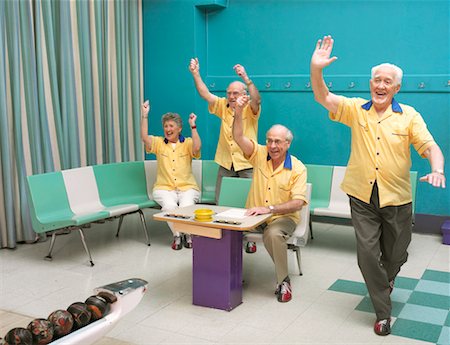 simsearch:600-01073545,k - Senior Bowling Team Cheering In Bowling Alley Stock Photo - Rights-Managed, Code: 700-00553619