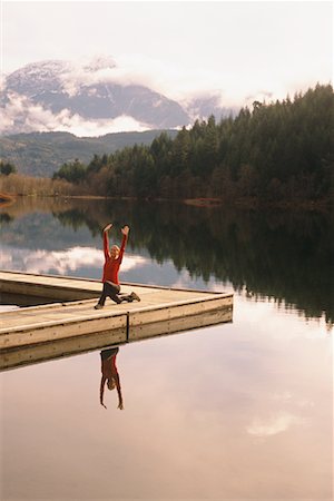 Woman Practicing Yoga on Dock Stock Photo - Rights-Managed, Code: 700-00560508