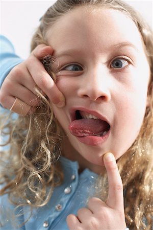 Girl Making Faces Stock Photo - Rights-Managed, Code: 700-00560553