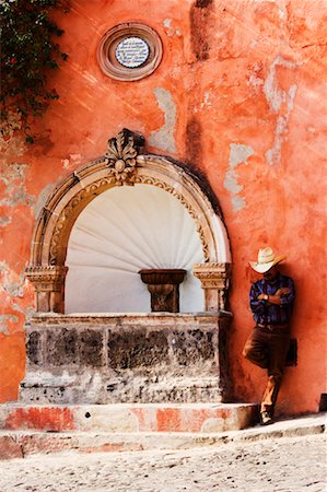 Man Leaning Against Building, San Miguel de Allende, Guanajuato, Mexico Stock Photo - Rights-Managed, Code: 700-00560808