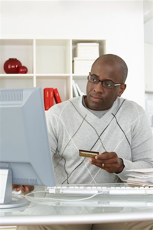 simsearch:700-00045560,k - Man in Home Office with Bills and Credit Card Stock Photo - Rights-Managed, Code: 700-00560865