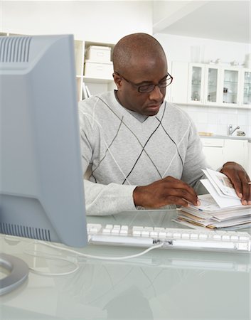 simsearch:700-00045560,k - Man in Home Office with Stack of Bills Stock Photo - Rights-Managed, Code: 700-00560862