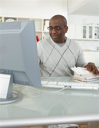 simsearch:700-00045560,k - Man in Home Office with Stack of Bills Stock Photo - Rights-Managed, Code: 700-00560863