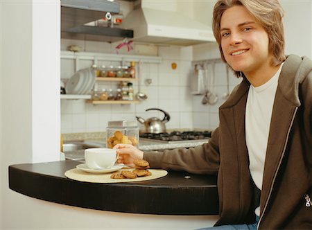 simsearch:700-00561804,k - Young Man Having Tea and Cookies Stock Photo - Rights-Managed, Code: 700-00561780