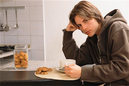 simsearch:700-00515127,k - Young Man Eating Cookies Stock Photo - Rights-Managed, Code: 700-00561804