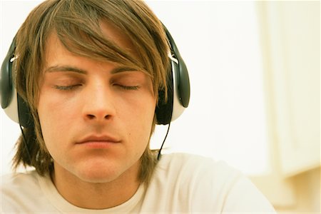 simsearch:700-00561804,k - Young Man With Headphones Listening to Music Stock Photo - Rights-Managed, Code: 700-00561816