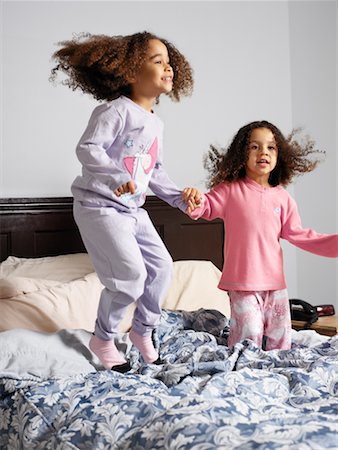 simsearch:700-00519358,k - Sisters Jumping on Bed Stock Photo - Rights-Managed, Code: 700-00588942