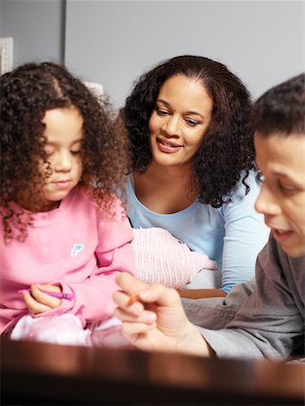parents sitting with kids for crafts - Family Colouring Stock Photo - Rights-Managed, Code: 700-00588952