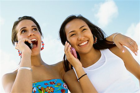 simsearch:600-03244230,k - Teenagers Using Cellular Telephones Stock Photo - Rights-Managed, Code: 700-00592436