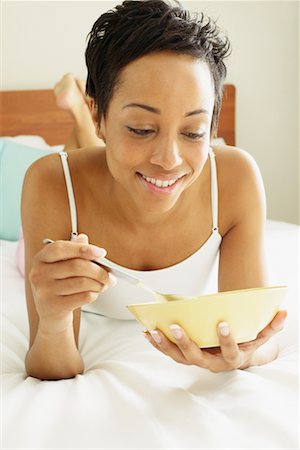 simsearch:700-00606802,k - Woman Eating Cereal in Bed Stock Photo - Rights-Managed, Code: 700-00605082
