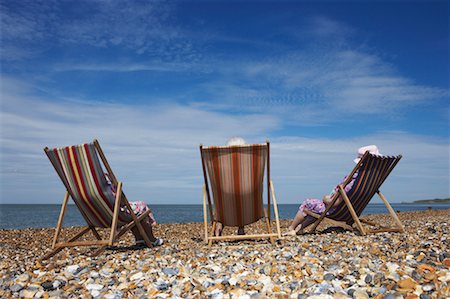 simsearch:700-01163568,k - Women Sitting on Beach Chairs Stock Photo - Rights-Managed, Code: 700-00606957