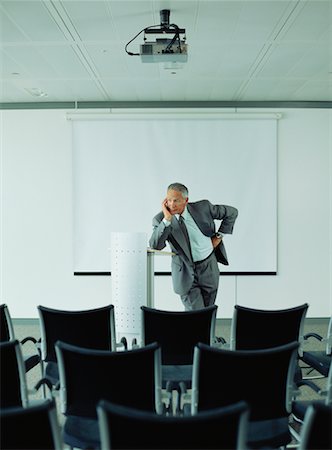 simsearch:6109-08203934,k - Businessman in Empty Boardroom Stock Photo - Rights-Managed, Code: 700-00607491