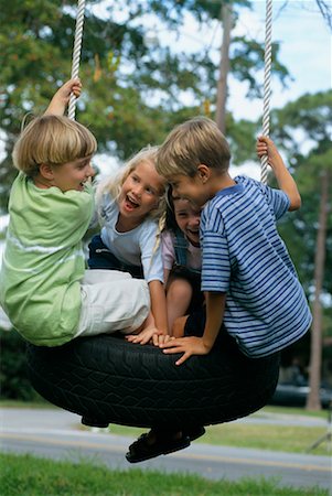 Children on Tire Swing Stock Photo - Rights-Managed, Code: 700-00607507