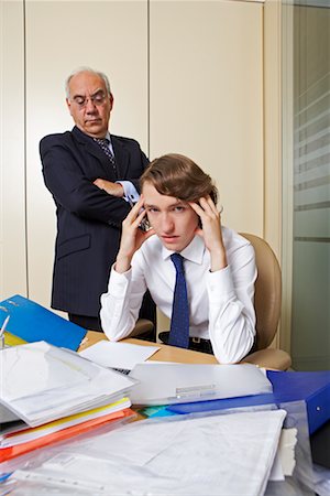 simsearch:700-00523344,k - Boss Watching Young Businessman Working Stock Photo - Rights-Managed, Code: 700-00608464