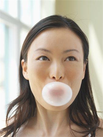 Portrait of Woman Blowing Bubble Stock Photo - Rights-Managed, Code: 700-00608816