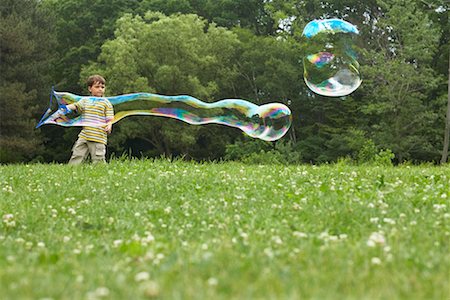 Boy Blowing Bubbles Stock Photo - Rights-Managed, Code: 700-00609027