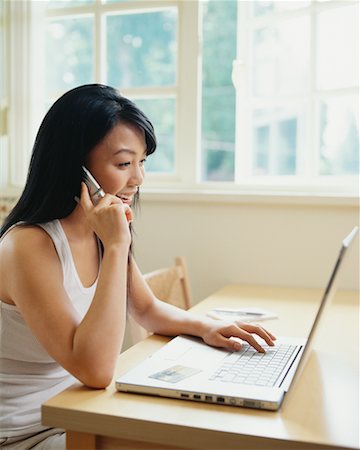 simsearch:700-00609249,k - Woman Using Laptop at Home Stock Photo - Rights-Managed, Code: 700-00609245