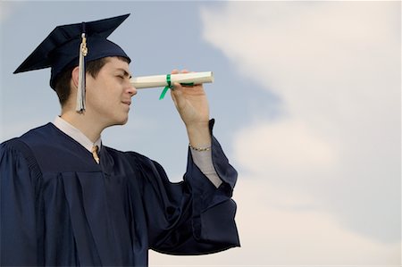 Graduate Using Diploma as Telescope Stock Photo - Rights-Managed, Code: 700-00609315