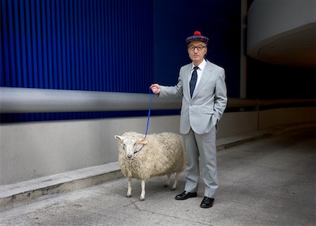 Man with Sheep on Leash Foto de stock - Con derechos protegidos, Código: 700-00609359