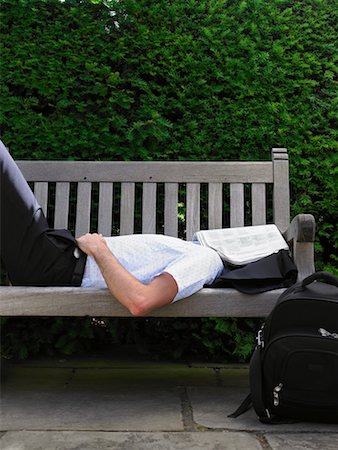 Man Lying Down on Park Bench Stock Photo - Rights-Managed, Code: 700-00609889