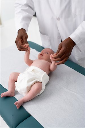 simsearch:700-00616624,k - Doctor Holding Newborn's Hands Foto de stock - Con derechos protegidos, Código: 700-00616601