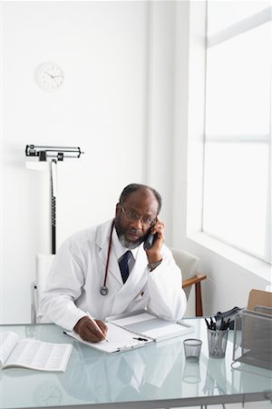 simsearch:700-00616627,k - Portrait of Doctor Working at Desk Stock Photo - Rights-Managed, Code: 700-00616614