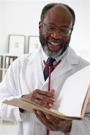simsearch:700-00616627,k - Portrait of Doctor Reading Chart Stock Photo - Rights-Managed, Code: 700-00616619