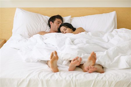 sleepy soles - Couple in Bed Stock Photo - Rights-Managed, Code: 700-00617098