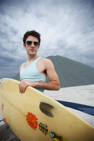 Potrait of Young Man Holding Surfboard Stock Photo - Rights-Managed, Code: 700-00618488