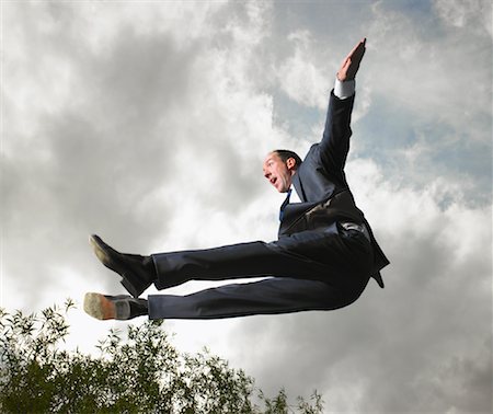 diving (not water) - Businessman Jumping in Air Stock Photo - Rights-Managed, Code: 700-00611242