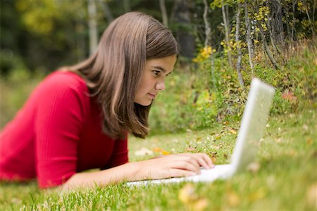 simsearch:6108-06905230,k - Girl Using Laptop Outdoors Stock Photo - Rights-Managed, Code: 700-00620308