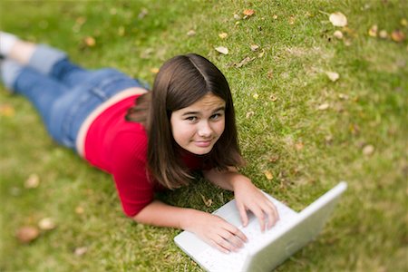 simsearch:400-05697169,k - Girl Using Laptop Outdoors Stock Photo - Rights-Managed, Code: 700-00620309
