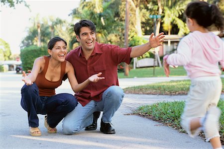 Girl Running to Parents Stock Photo - Rights-Managed, Code: 700-00634112