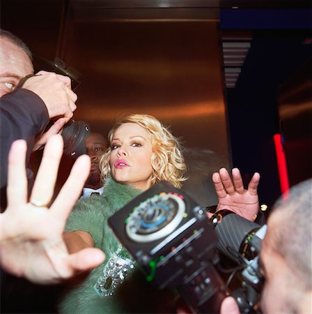 star (famous, female) - Woman Trying to Stop Paparazzi From Taking Her Picture Stock Photo - Rights-Managed, Code: 700-00634125