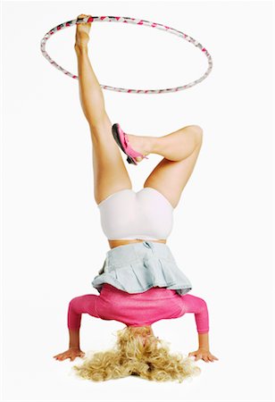 simsearch:700-01112521,k - Woman Doing Headstand, Spinning Hula-Hoop With Leg Stock Photo - Rights-Managed, Code: 700-00635586