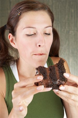 Woman Eating Chocolate Cake Foto de stock - Con derechos protegidos, Código: 700-00635825