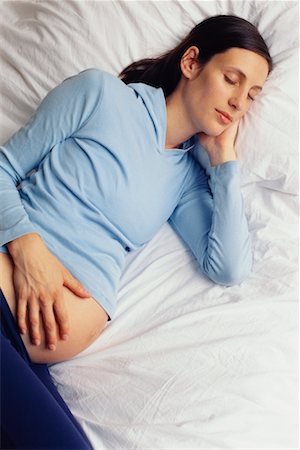 simsearch:700-00522867,k - Pregnant Woman Sleeping Stock Photo - Rights-Managed, Code: 700-00639360