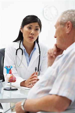 doctor with ethnic patient in office - Doctor with Patient Stock Photo - Rights-Managed, Code: 700-00639399