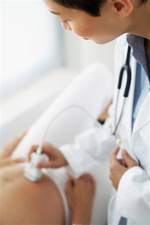 fertility clinic - Doctor Performing Ultrasound Stock Photo - Rights-Managed, Code: 700-00639470