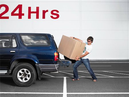 Man Loading Box into Truck Stock Photo - Rights-Managed, Code: 700-00644037