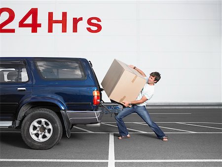 Man Loading Box into Truck Stock Photo - Rights-Managed, Code: 700-00644038