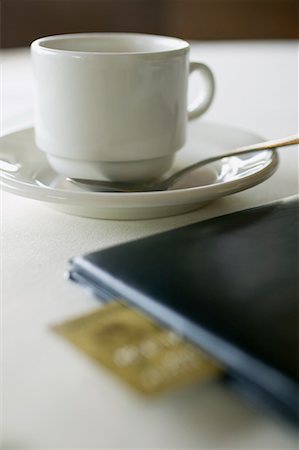 simsearch:700-00085293,k - Coffee Cup and Cheque Book at Restaurant Stock Photo - Rights-Managed, Code: 700-00641586
